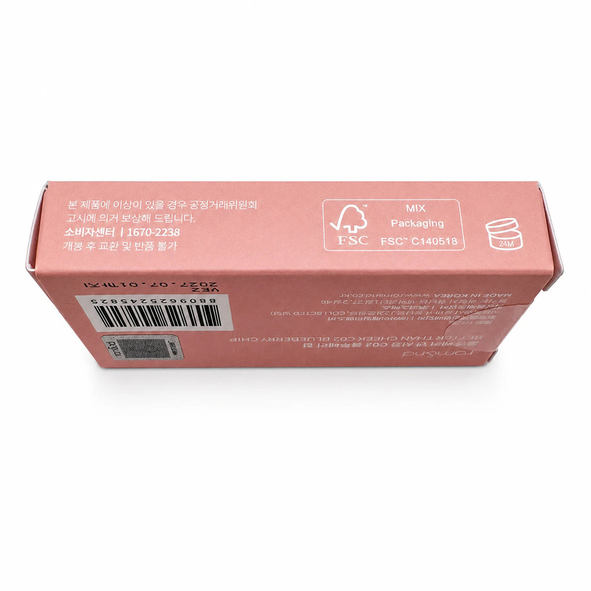 A light beige cardboard packaging box shown from an angled top view on a white background, featuring a barcode and a FSC certification logo.