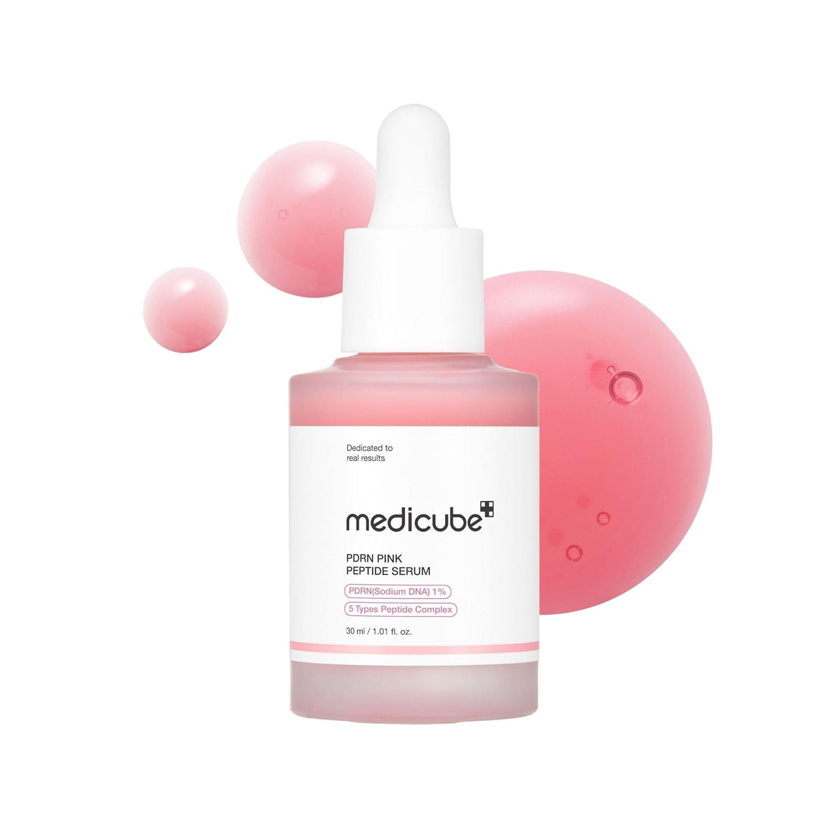 Medicube PDRN Pink Peptide Serum with Salmon DNA bottle surrounded by pink droplets on a white background.