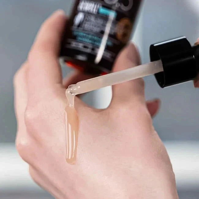 Close up of ACWELL licorice serum texture dispensed from a dropper
