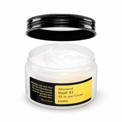 Open COSRX Advanced Snail 92 All in One Cream 100g jar with a lifted black lid and white cream on a white background.