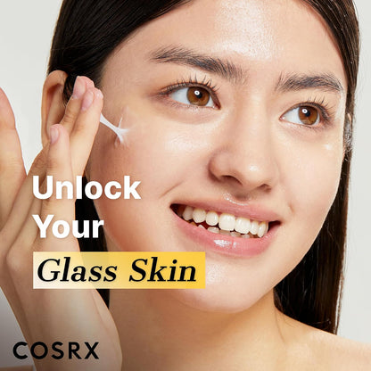 Woman stretching white cream beside her cheek in a COSRX Snail 92 application image with a glass-skin message.