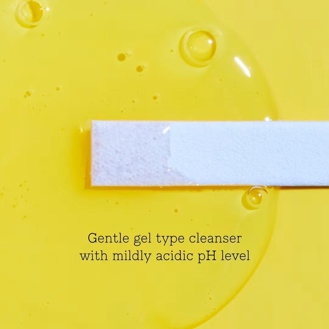 pH test strip on a clear gel swatch against a yellow background for COSRX Low pH Good Morning Gel Cleanser.