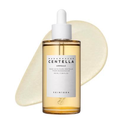 SKIN1004 Madagascar Centella Ampoule 100ml dropper bottle in front of a pale golden serum swatch.