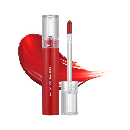 Open rom&nd Glasting Water Tint 02 Red Drop 4g tube and clear wand beside a glossy red heart-shaped swatch on a white background.