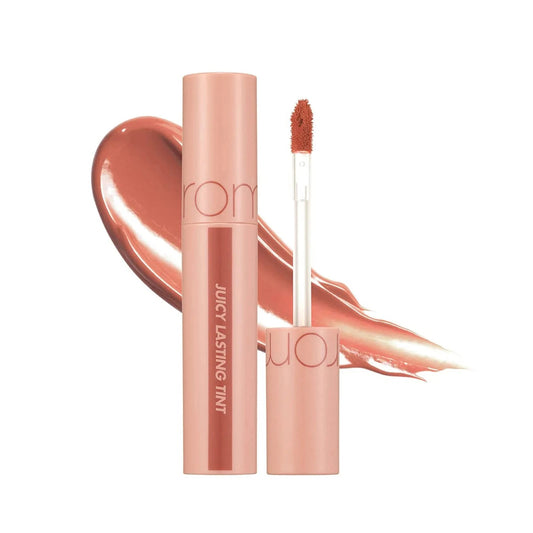 rom&nd Juicy Lasting Tint 22 Pomelo Skin open tube over a peach-coral swatch