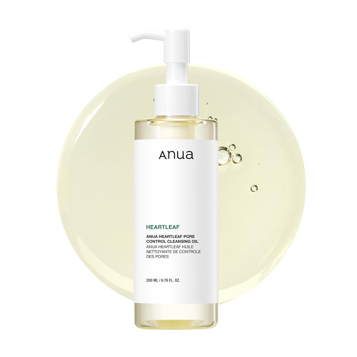 ANUA Heartleaf Pore Control Cleansing Oil 200ml pump bottle with oil droplets on a pale yellow background.