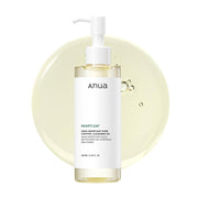 ANUA Heartleaf Pore Control Cleansing Oil 200ml pump bottle with oil droplets on a pale yellow background.