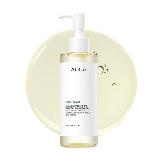 ANUA Heartleaf Pore Control Cleansing Oil 200ml pump bottle with oil droplets on a pale yellow background.