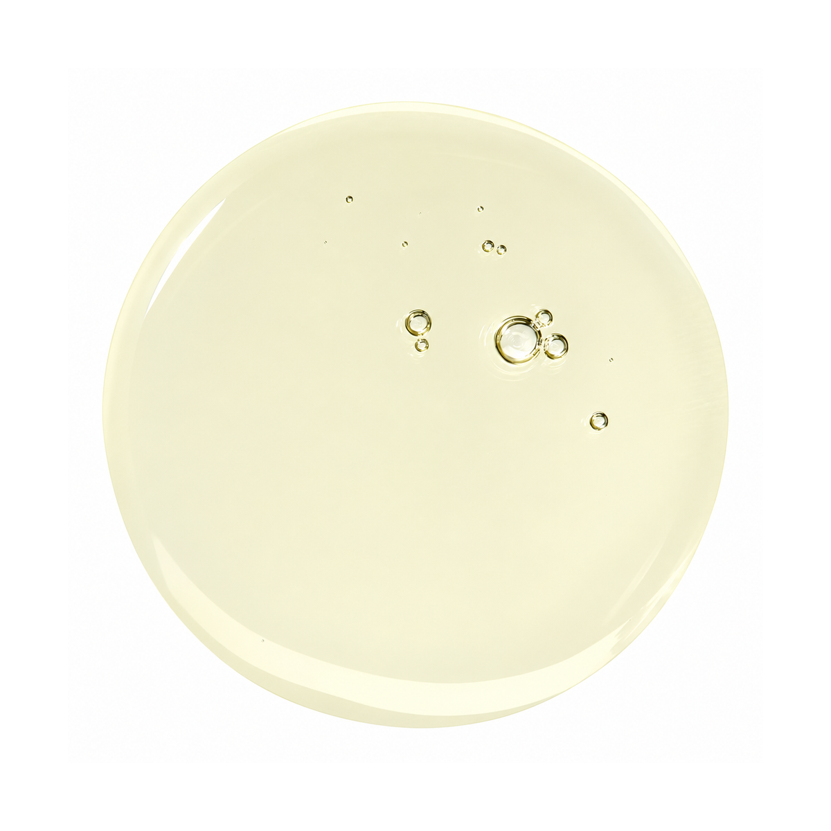 Close-up of ANUA Heartleaf Pore Control Cleansing Oil with oil droplets on a pale background.