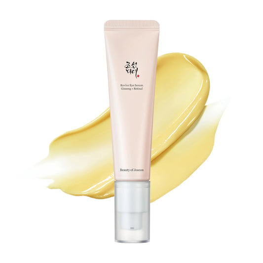 Beauty of Joseon Revive Eye Serum Ginseng + Retinal 30ml pump tube beside a yellow cream swatch on white.
