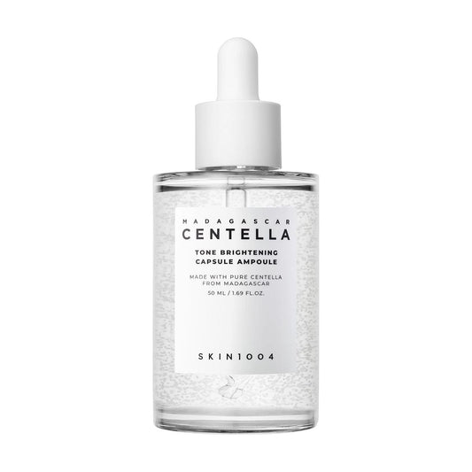 SKIN1004 Madagascar Centella Tone Brightening Capsule Ampoule 50ml bottle with a white dropper and visible capsules.
