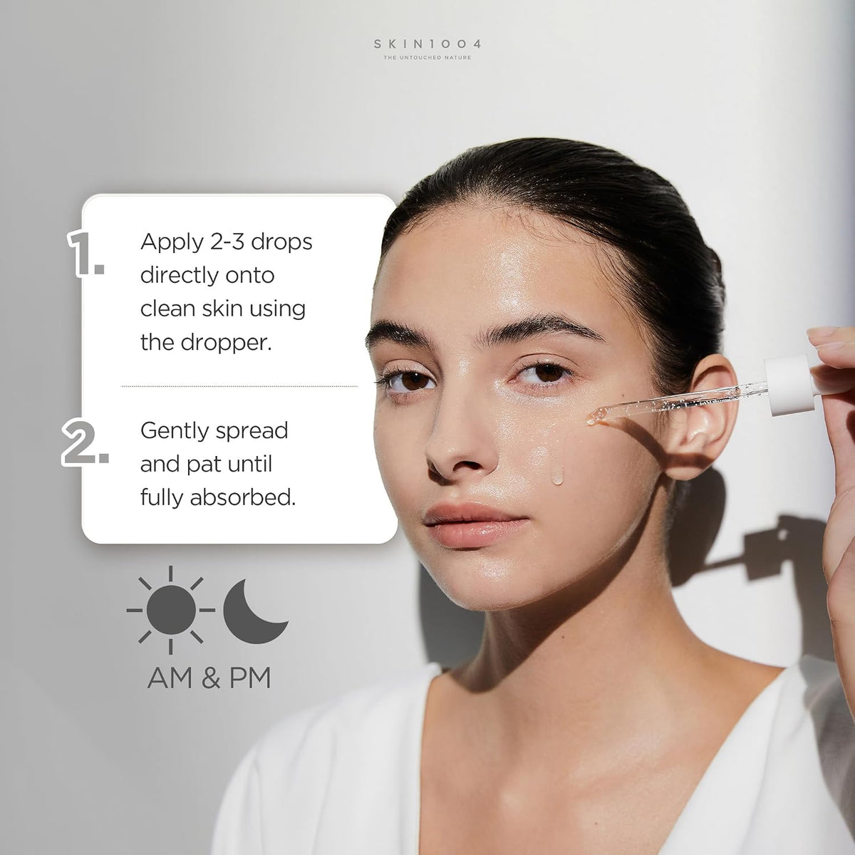 Model applies SKIN1004 ampoule with a dropper; directions show two to three drops, then gently spreading and patting.