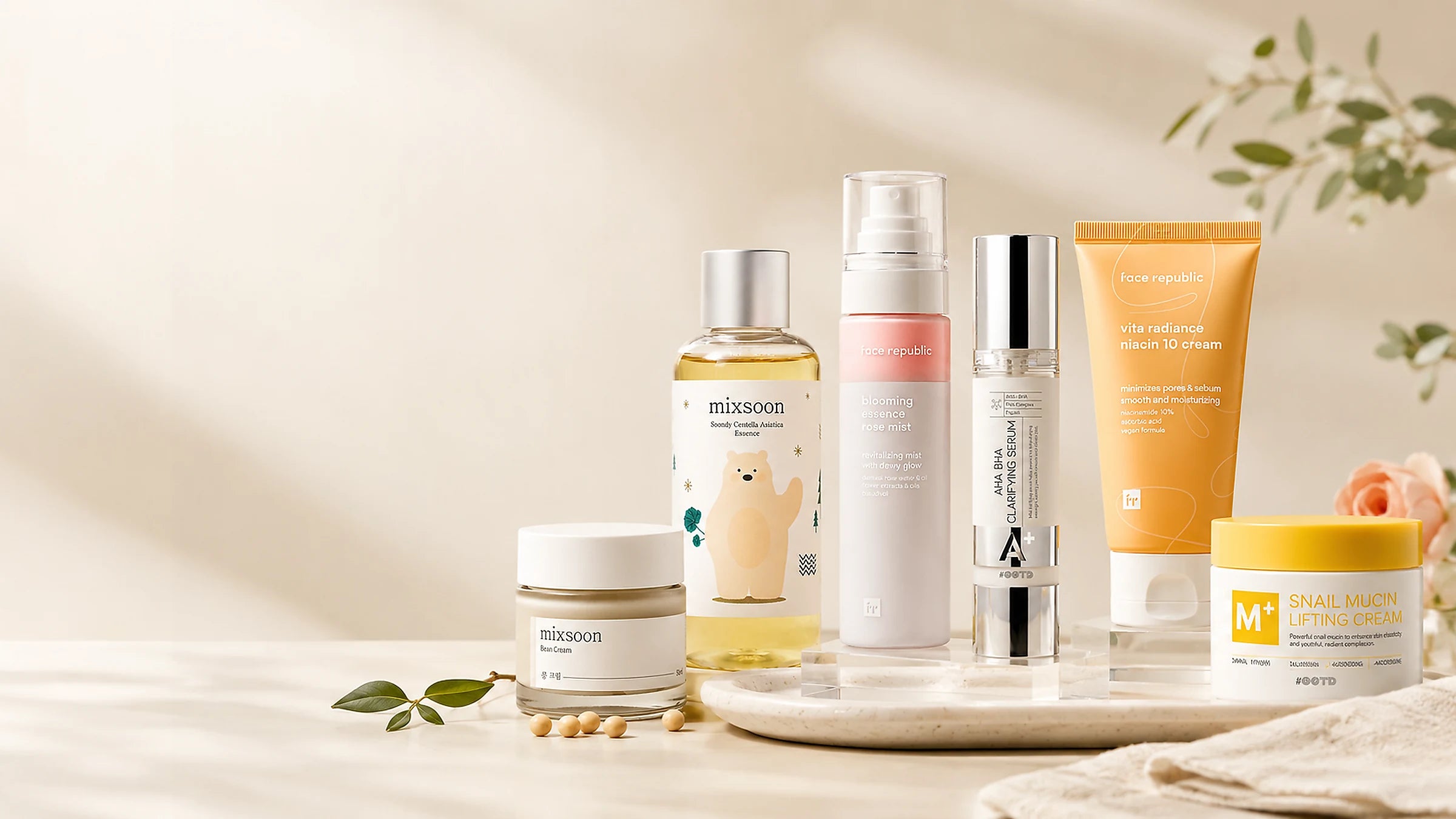 Collection of Korean skincare products on a neutral background with a soft focus